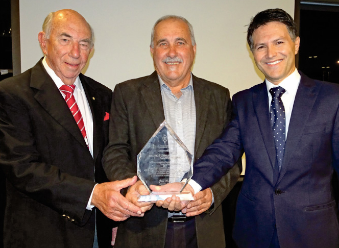 Photo of Maurie Dawson receiving his Ryde Sports Foundatioin Contributioin to Sport Award from Jim Hull & Ryde MP Victor Dominello