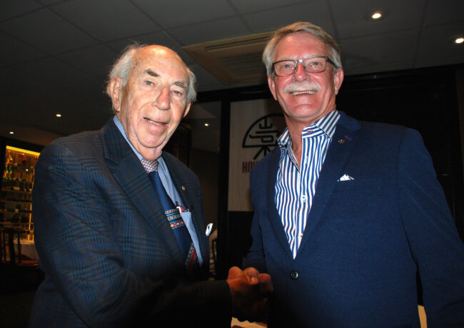 Photo of Jim Hull OAM congratulating Rob Wilkinson at the 2020 AGM